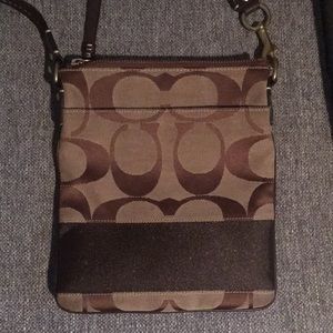 Coach crossbody bag with adjustable strap.